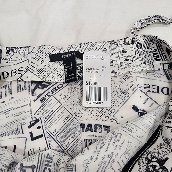 Mini newspaper print dress - a fashionably fearless find!" - Picture 3 of 5